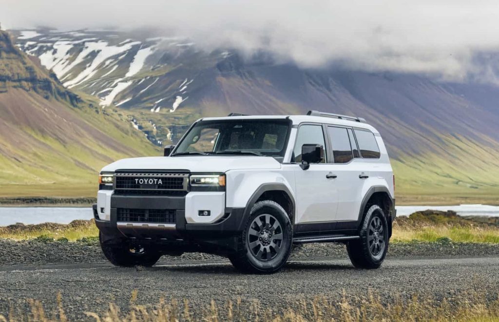 Luxury SUV driving through scenic mountain roads in Nepal