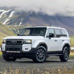 Luxury SUV driving through scenic mountain roads in Nepal