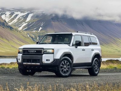 Luxury SUV driving through scenic mountain roads in Nepal