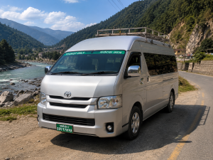Toyota Hiace tourist van travelling from Kathmandu to Pokhara through Nepal's scenic mountain highway